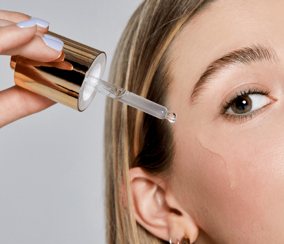 Young model with dropper on face