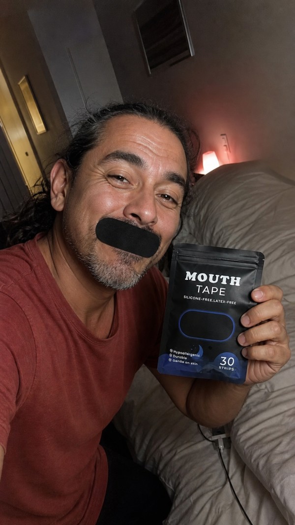 Sergio, age 47, wearing a black mouth strip