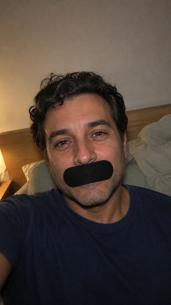 Josh, age 42, wearing a black mouth strip