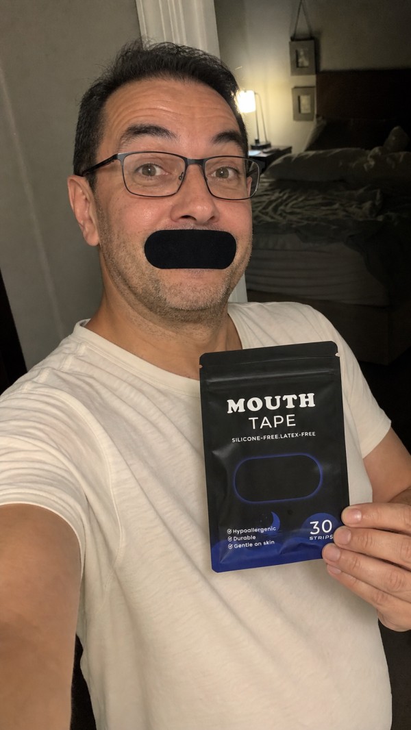 Anthony, age 45, wearing a black mouth strip