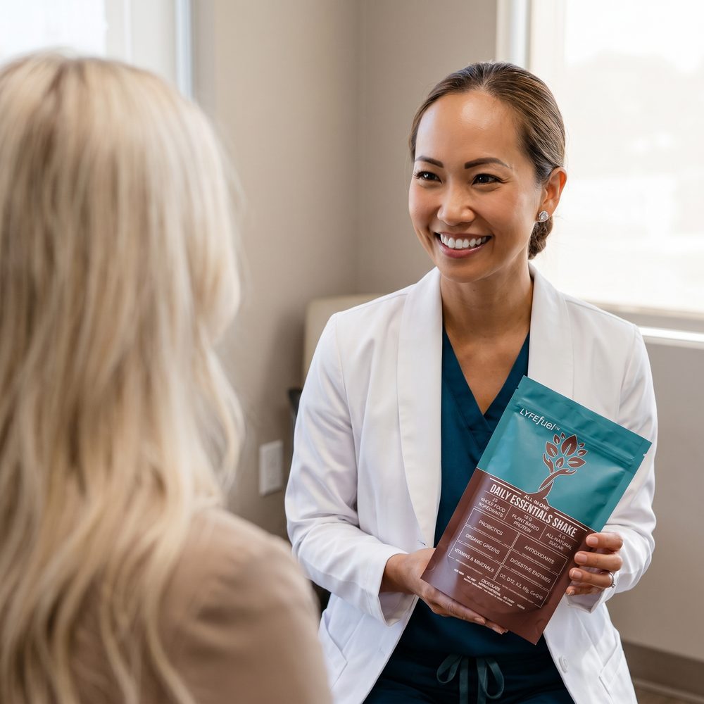 A clinician showing a bag of LyfeFuel Essentials to a patient